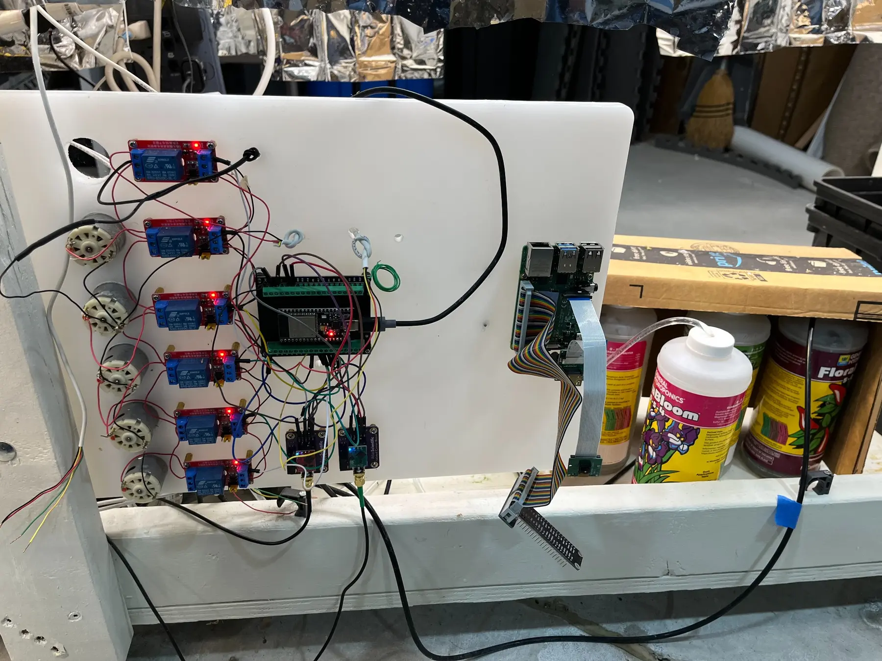 ESP32 development board and breakout installed on the hydroponic control panel beside the previous Raspberry Pi hardware